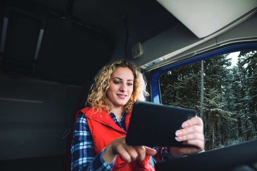 Field worker using a tablet in a vehicle